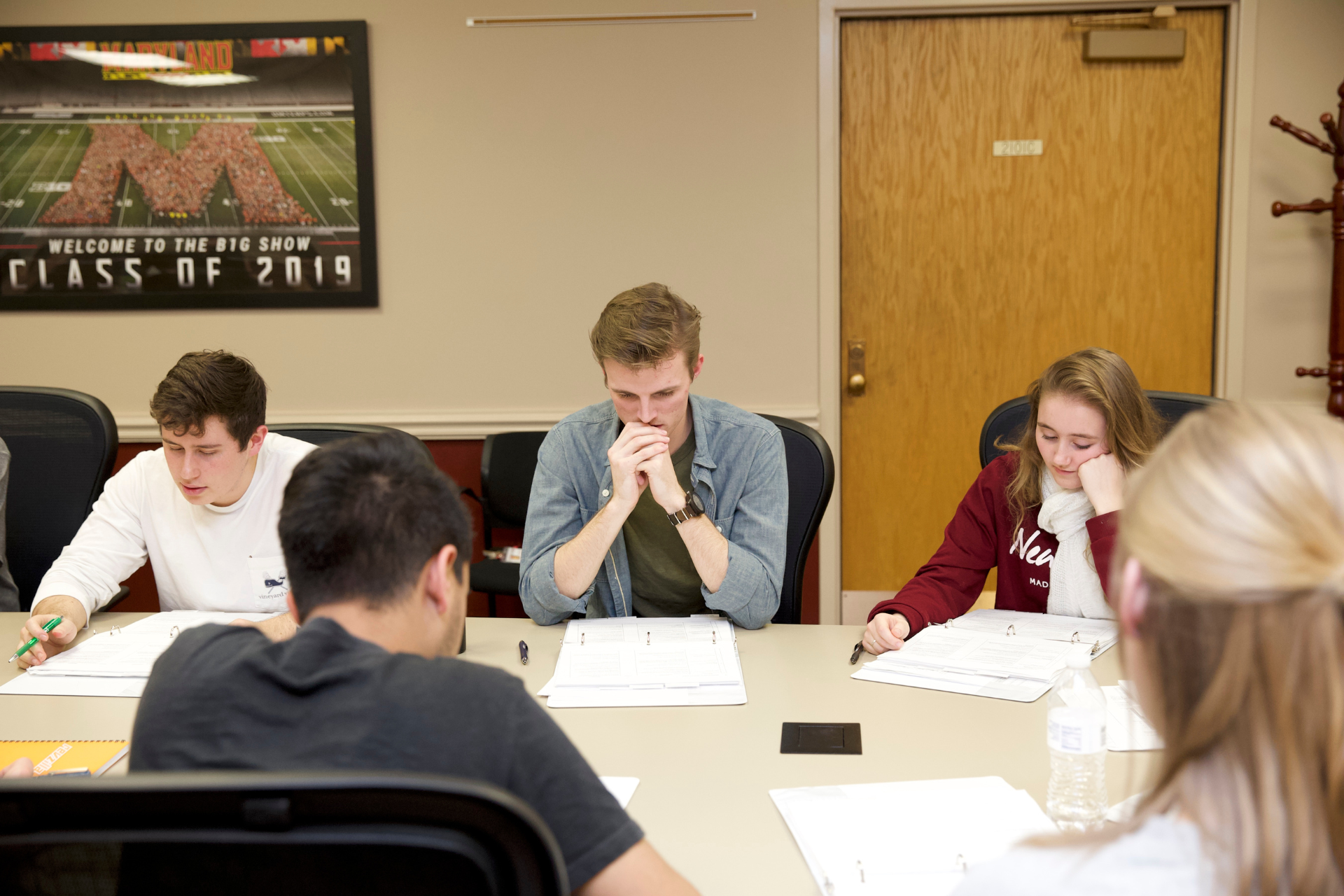 students sitting around a conference room table