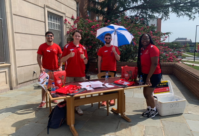 group of resident assistants outdoors helping during move-in