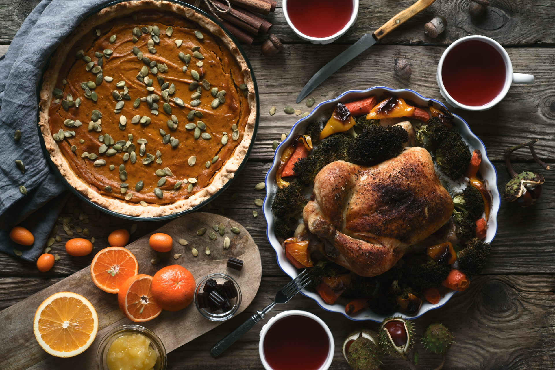 table with pumpkin pie and turkey for thanksgiving