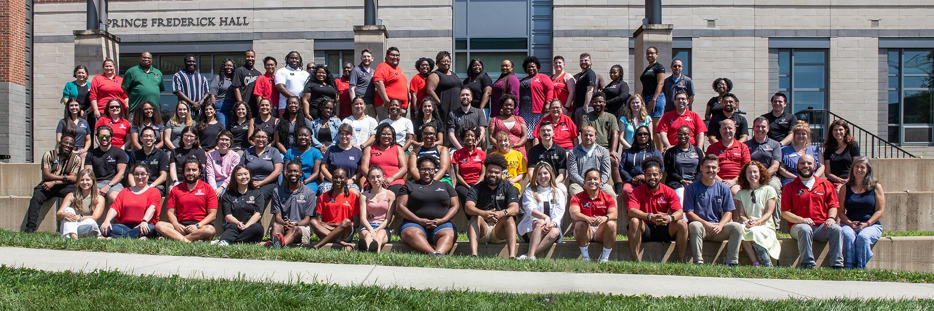 group shot of Res Life staff on outside steps of Prince Frederick Hall