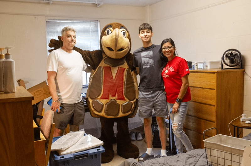 New student with family and testudo in there res hall room