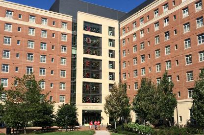 Exterior of Oakland Hall with "GO TERPS" spelled out in the windows.