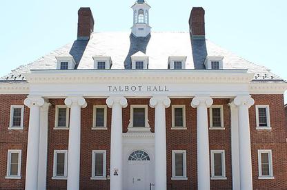 Exterior of Talbot Hall, a brick building with large columns and a small white rooftop cupola.